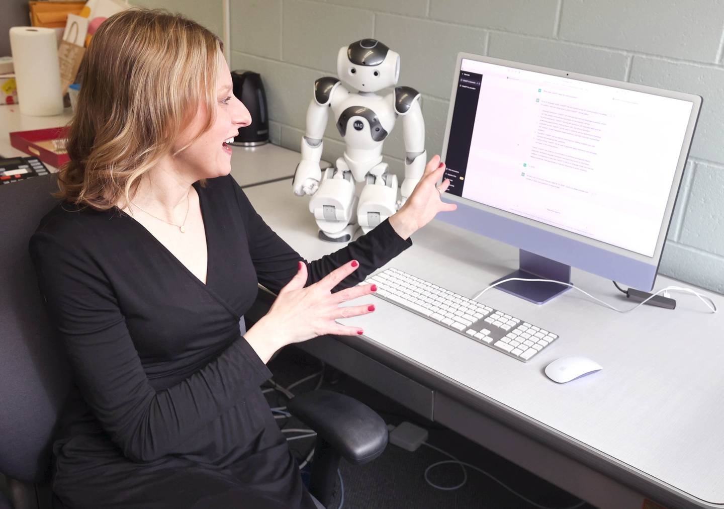 Andrea Guzman, associate professor of communications at Northern Illinois University, talks Thursday, March 30, 2023, in Reavis Hall at NIU, about ChatGPT, an artificial-intelligence chatbot.
