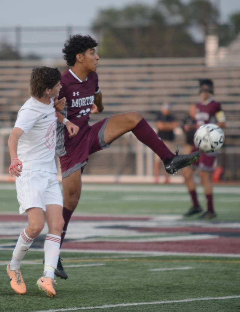 Morton West's Christian Valadez defends the ball against Naperville Central during their home game in Berwyn Monday, Aug. 21, 2023.
