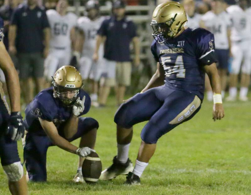 Marquette's Sam Mitre (54) kicks a 22-yard field goal against Annwan-Wethersfield on Friday, Sept. 16, 2022 at Gould Stadium in Ottawa.