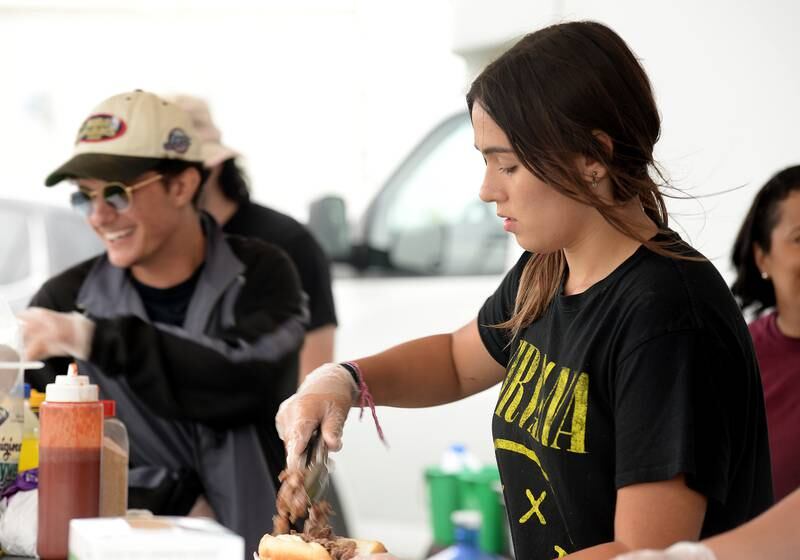 LaGrange Endless SummerFest server, Kayla Chrenen of Countryside prepares an Italian Beef for a fest attendee Sunday Aug 6, 2023.