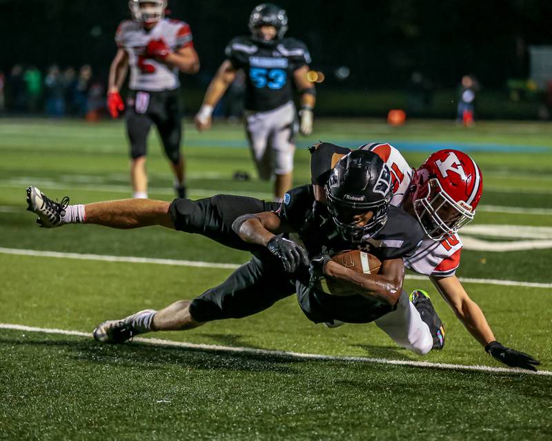 Willowbrook's KJ Rhodes (0) dives for extra yards during Class 7A football playoff game between Yorkville at Willowbrook.   Oct 27, 2023.