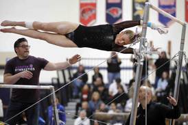 Gymnastics: Defending champs Haylie Hinckley of Wheaton co-op, Downers Grove co-op team return with high hopes