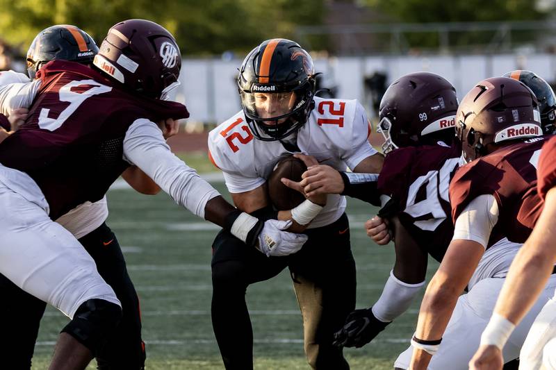 Lincoln-Way West's Grant Tustin goes up against Lockport’s defense during a varsity football game at Lockport Township High School’s East Campus on Sept. 5, 2025.