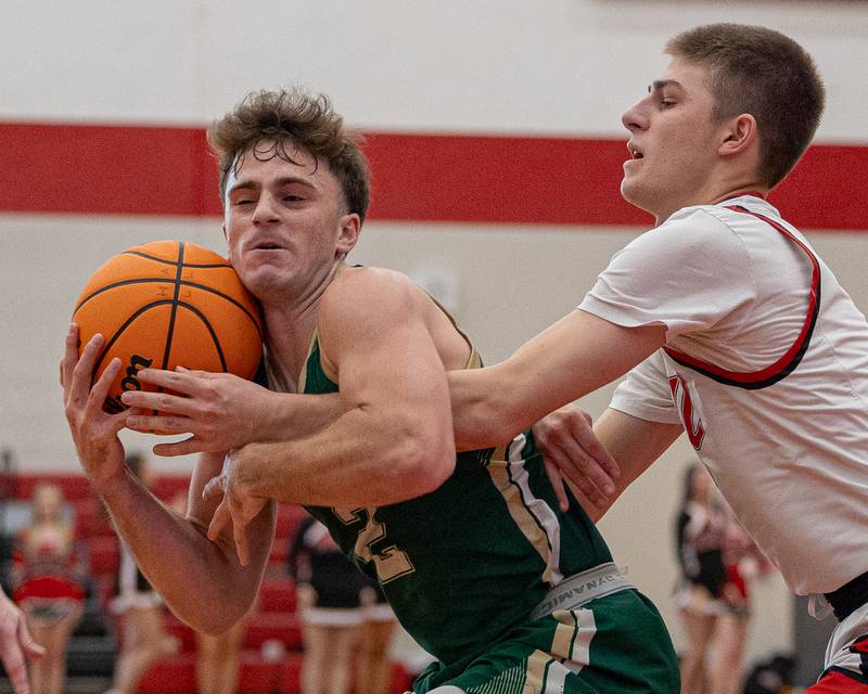 St. Bede's Gus Burr (2) holds ball as Luke Bryant (4) of Hall reaches under-arm on Saturday, January 31, 2026 at Hall High School in Spring Valley.