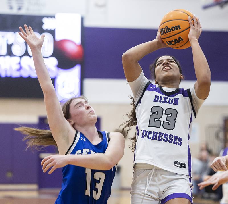 Dixon’s Ahmyrie McGowan puts up a shot over Geneva’s Linnea Popp Thursday, Feb. 19, 2026, in the Class 3A girls basketball regional title game.