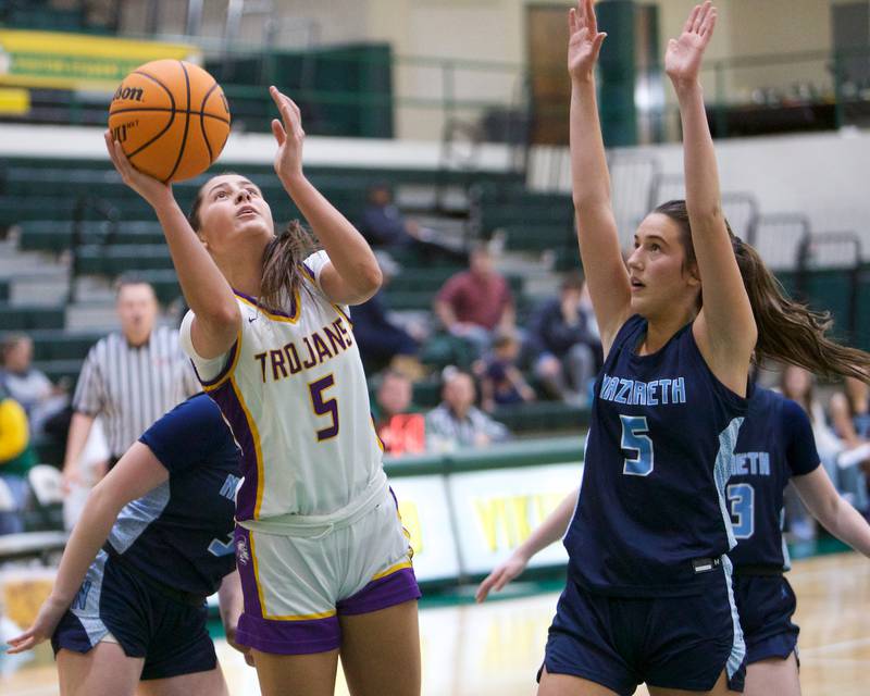 Downers Grove North's Campbell Thulin goes in for the shot against Nazareth during the Dave Yates Chicagoland Showcase on Saturday, Dec7,2024 at Fremd in Palatine.
