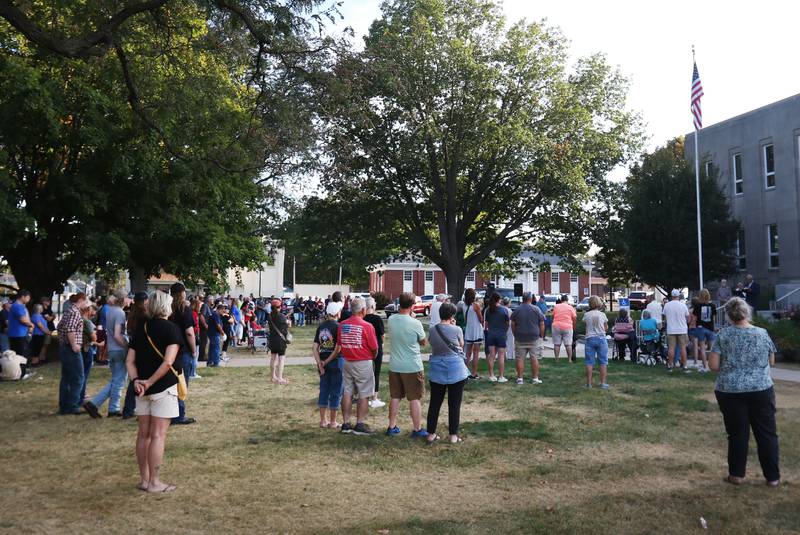A large crowd of nearly 200 people gather during a vigil for Charlie Kirk on the front steps of the Bureau County Courthouse on Monday, Sept. 15, 2025 in Princeton.