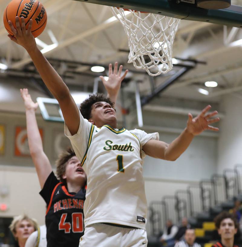 Crystal Lake South's Noah Cook shoots the ball in front of McHenry's Nate Ottaway during a Fox Valley Conference boys basketball game on Wednesday, Jan. 14, 2026, at Crystal Lake South High School.