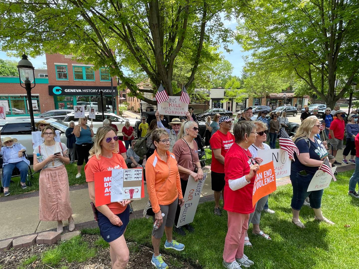 People hold signs while attending a rally against gun violence in Geneva on Saturday.