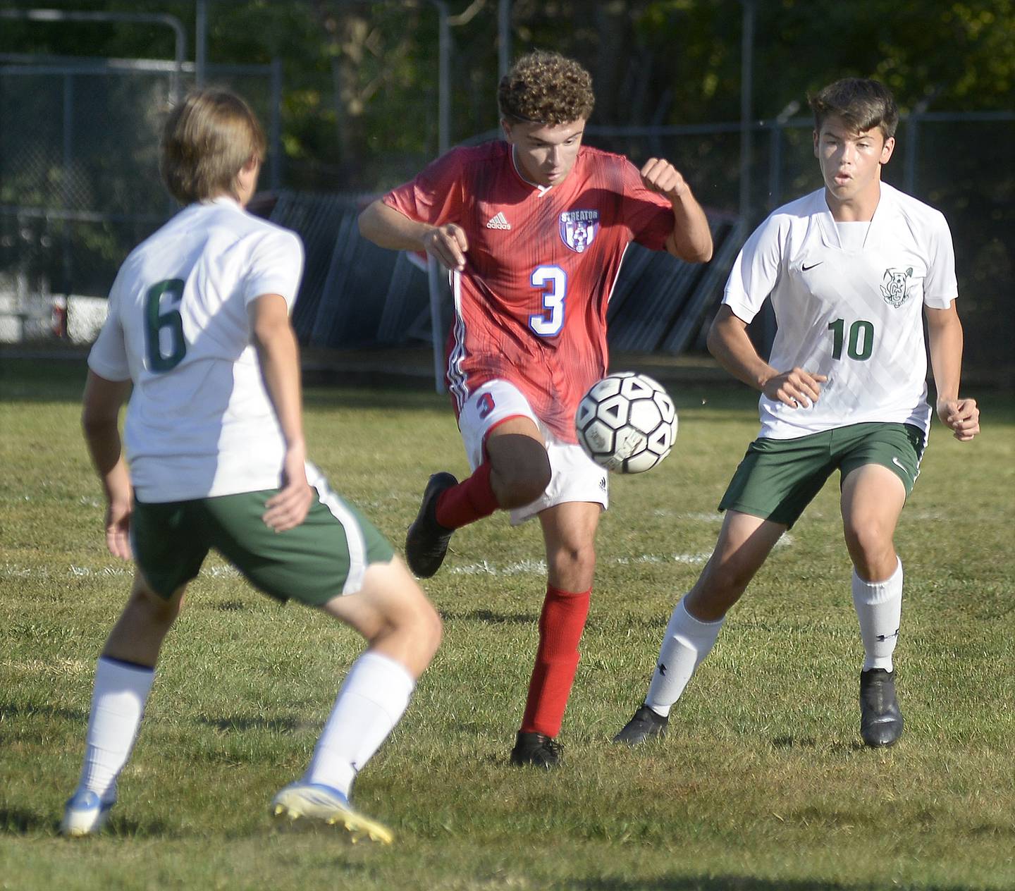 Streator’s Moe Bacon (3) splits the defense of Coal City’s Chad Reinert (6) and Caleb Figueroa (10) during first half of a match Tuesday, Oct. 4, 2022 at Streator.