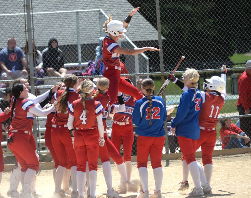 Morrison's Bella Duncan is tossed into the air by her teammates after hitting a home run in the Fillies 5-0 win over Oregon on Saturday, May 17, 2025 at Oregon Park West.