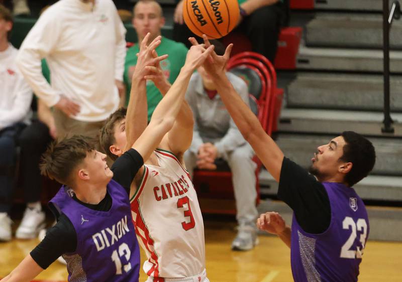 Dixon's Beckham Rock and Zander Wilson knocks the ball free from L-P's Braylin Bond on Tuesday, Jan. 20, 2026 in Sellett Gymnasium at L-P High School.