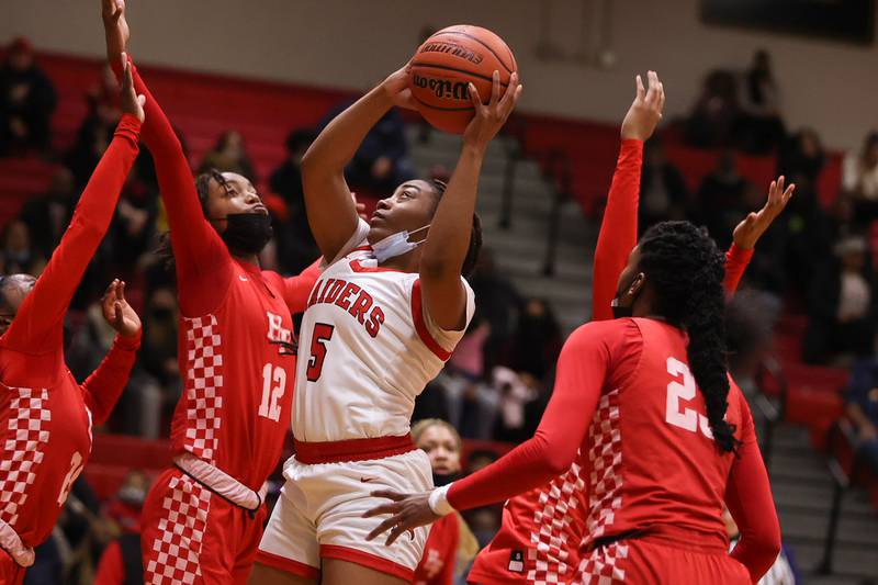 Bolingbrook’s Kennedi Perkins battles in the paint for a shot against Homewood-Flossmoor in the Class 4A Bolingbrook Sectional championship. Thursday, Feb. 24, 2022, in Bolingbrook.