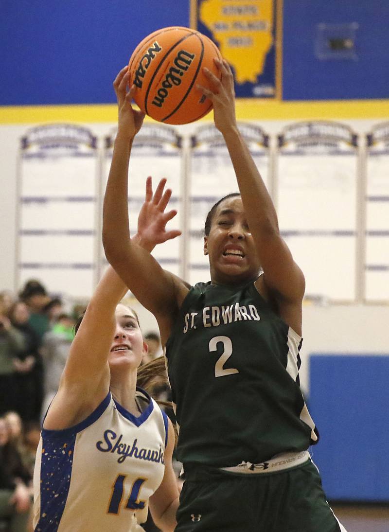 St. Edward's Savannah Lynch (right) grabs a rebound in front of Johnsburg's Summer Toussaint during the IHSA Class 2A Johnsburg Sectional girls basketball championship game on Thursday, February, 26, 2026, at Johnsburg High School.
