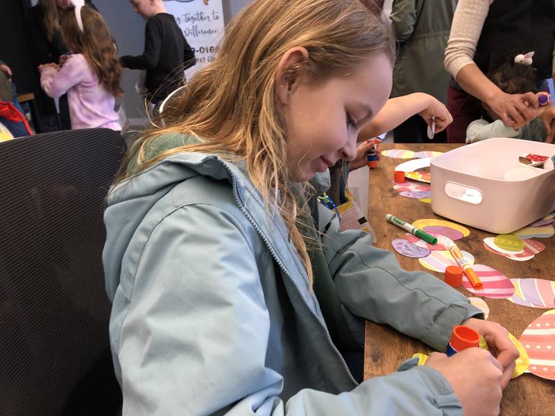 Lennyx Halstead, 8, of Huntley, makes an Easter craft at the Huntley Area Chamber of Commerce scavenger hunt March 29, 2024.