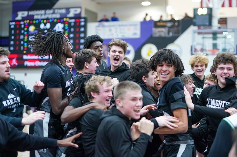 Kaneland fans storm the court after Kaneland defeats Yorkville Christian to win the championship final basketball game in the 61st annual Plano Christmas Classic at Plano High School on Saturday, December 28, 2024.