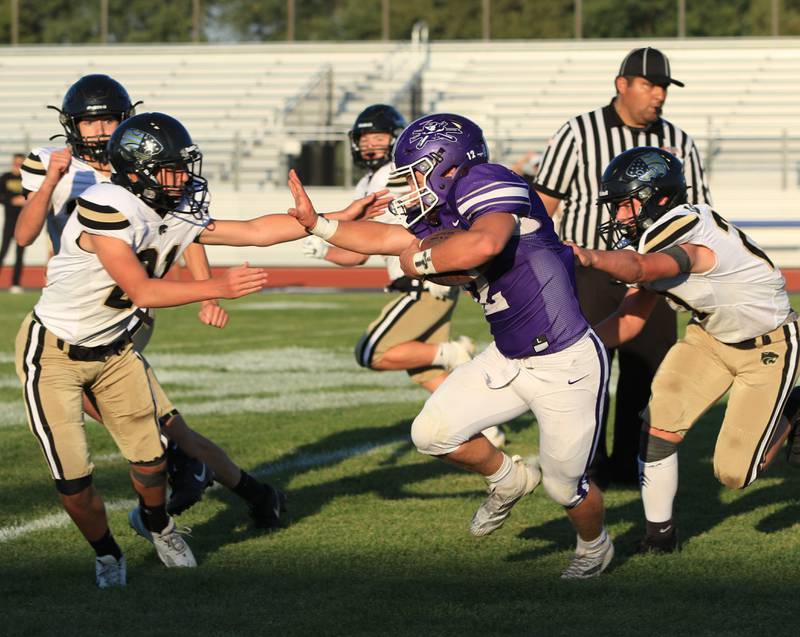 Rochelle's Andrew Eyster (12) carries the ball during their JV football game with Lena-Winslow on Friday, Sept. 12, 2025.