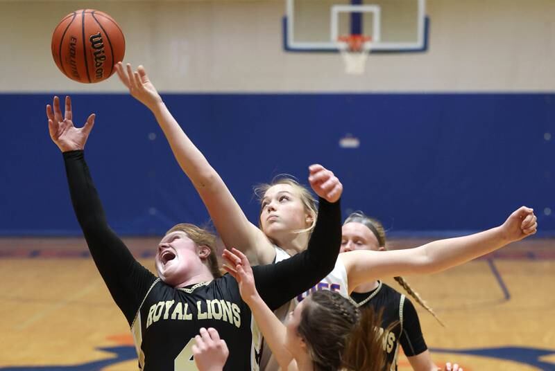 Genoa-Kingston's Bryce Boylen tries to get a rebound over Rockford Christian's Courtney Park during their game Friday, Jan. 13, 2023, at Genoa-Kingston High School.