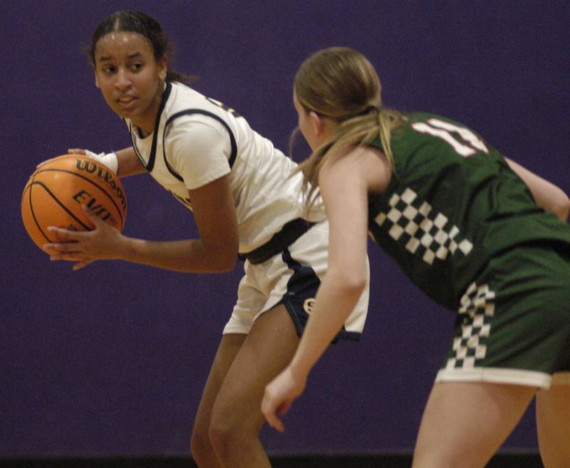 Sterling's Aliva Gibson comes up against  Lincoln's defense. The Sterling Golden Warriors played  the Lincoln Railsplitters in the Dixon Holiday Tournament at Reagan Middle School in Dixon on Friday, December 26th, 2025.