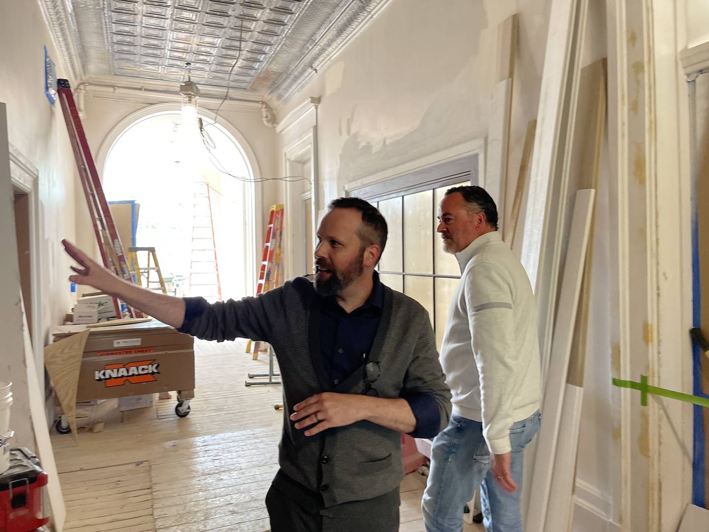 Woodstock City Planner Darrell Moore (left) and Woodstock Mayor Mike Turner (right) walk through the Old Courthouse and Sheriff's House on Thursday, May 25, 2023.