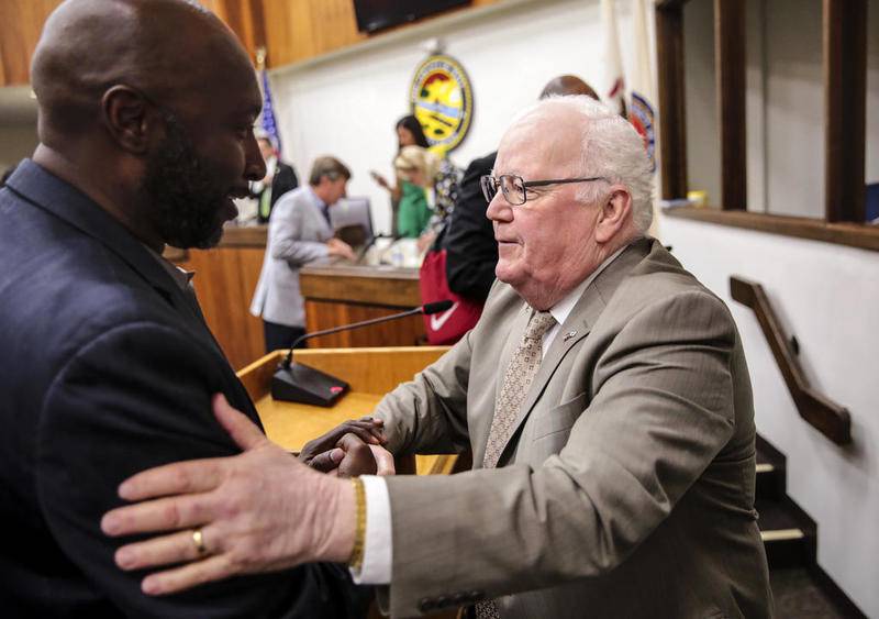 Will County Executive Larry Walsh Sr., who died Wednesday, shakes hands with supporters and county board members in August after announcing he would not  seek re-election because of a recurrence of prostrate cancer.