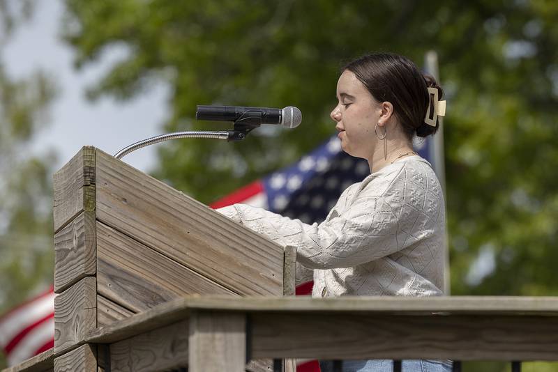 Leah Stach reads General Logan’s Orders Monday, May 26, 2025, during a Memorial Day ceremony at Oakwood Cemetery in Dixon. The order, designated on May 30, 1868, “for the purpose of strewing with flowers or otherwise decorating the graves of comrades who died in defense of their country during the late rebellion.”