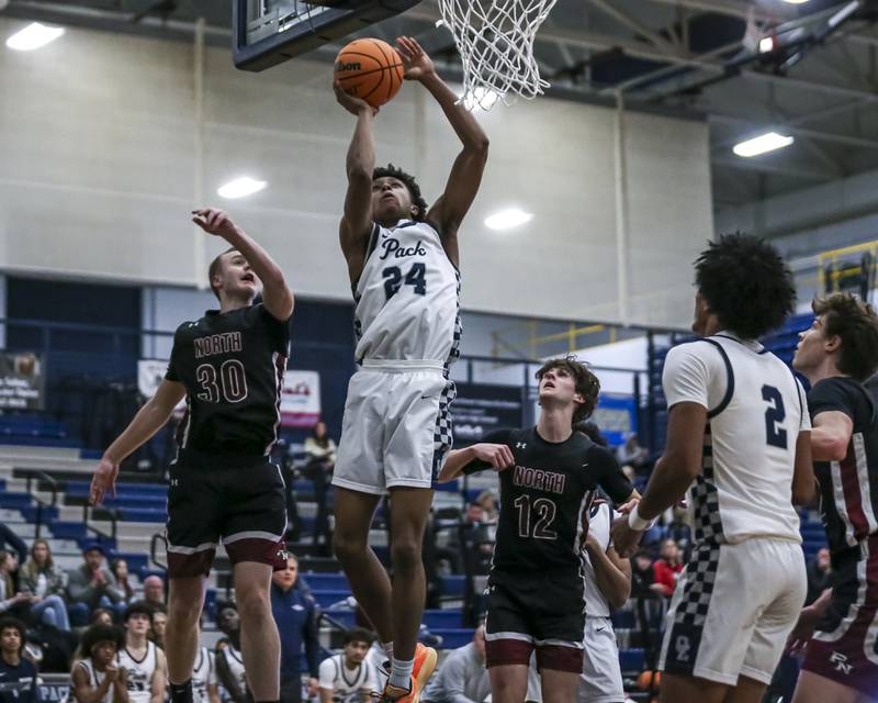 Oswego East's Dshaun Bolden (24) takes off to the basket during their basketball game between Plainfield North at Oswego East Friday, Dec 5, 2025 in Oswego.