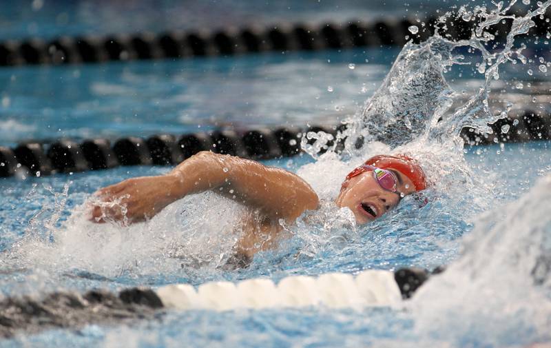 Hinsdale Central’s Burlingtyn Bokos swims the 500-yard freestyle during the IHSA Girls State Championships preliminaries at the FMC Natatorium in Westmont on Friday, Nov. 11, 2022.