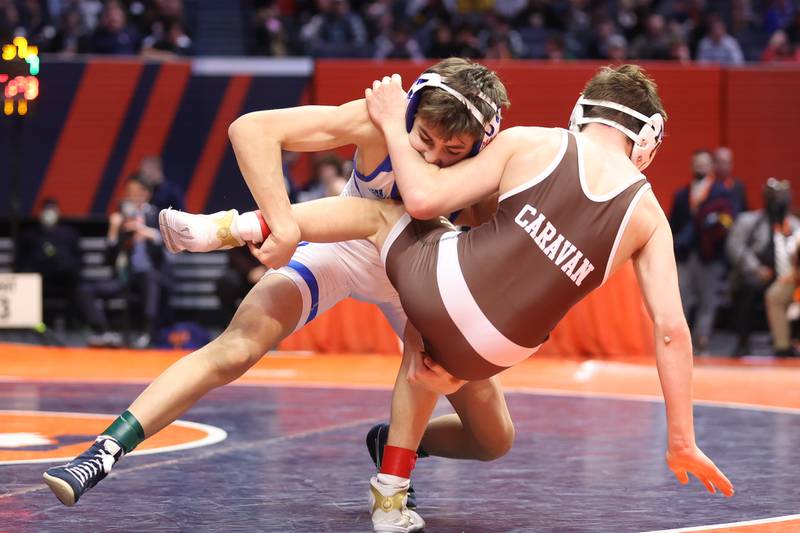 Marmion’s Jameson Garcia throws Mt. Carmel’s Damian Resendez to the mat in the Class 3A 113lb. championship match at State Farm Center in Champaign. Saturday, Feb. 19, 2022, in Champaign.