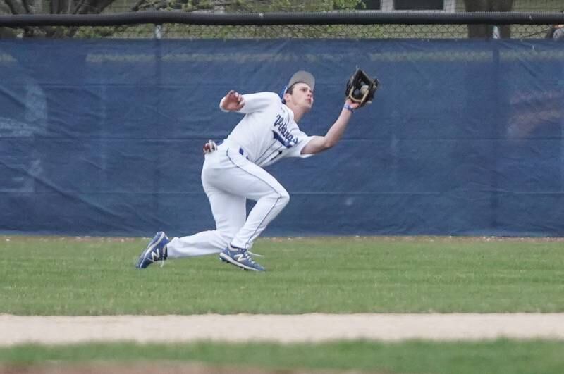 Geneva’s Blake Kopec (15) makes a diving catch for an out against Lake Park during a baseball game at Geneva High School on Wednesday, April 17, 2024.