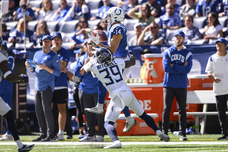 Indianapolis Colts wide receiver Alec Pierce (14) catches a pass against Tennessee Titans defensive back Terrance Mitchell (39) on the sidelines during an NFL football game in Indianapolis. (AP Photo/Zach Bolinger)