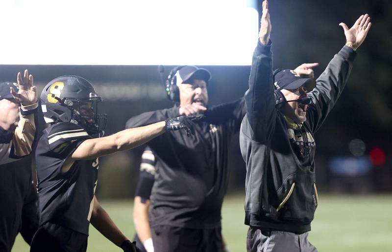 Sycamore's head coach Joe Ryan reacts to his team scoring a touchdown during their game against Morris Friday, Oct. 21, 2022, at Sycamore High School.