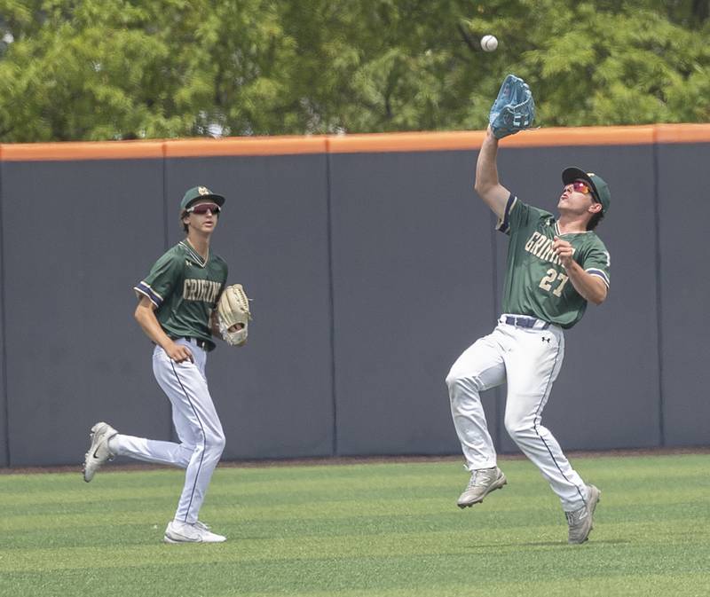 Father McGivney’s Ben Sink hauls in a fly ball against Ottawa Marquette Saturday, June 7, 2025, during the Class 1A state baseball final at Illinois Field in Champaign.
