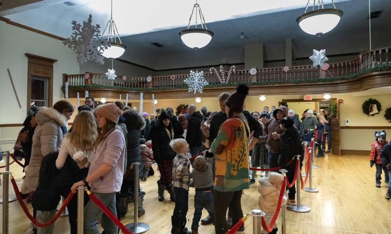 Crowds wait patiently in line for a chance to get a picture with Santa and Mrs. Claus during Christmas festivities in La Grange on Saturday, Dec. 3, 2022.