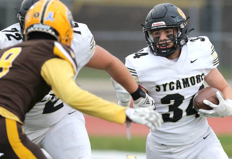 Sycamore's Joey Puleo carries the ball during their Class 5A second round playoff game against Carmel Saturday, Nov. 5, 2022, at Carmel Catholic High School in Mundelein.