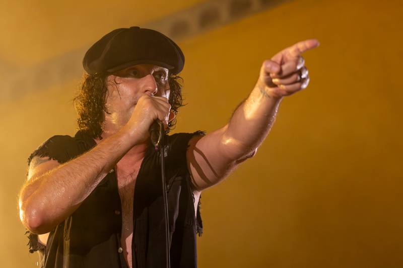 Bobby Lee Stamper of Thunderstruck points at the crowd during a performance at the annual Cops for Cancer event on Friday, July 25, 2025, at Cerri Memorial Park in Cedar Point.