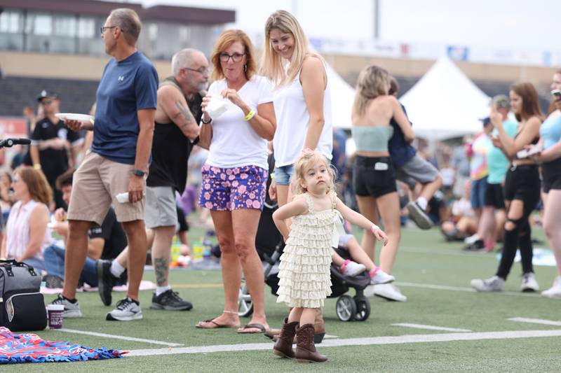 Shaelyn Norman dances, 3, dances on her birthday as her grandmother Pattie and mother Megan watch on day 2 of the Taste of Joliet. Saturday, June 25, 2022 in Joliet.