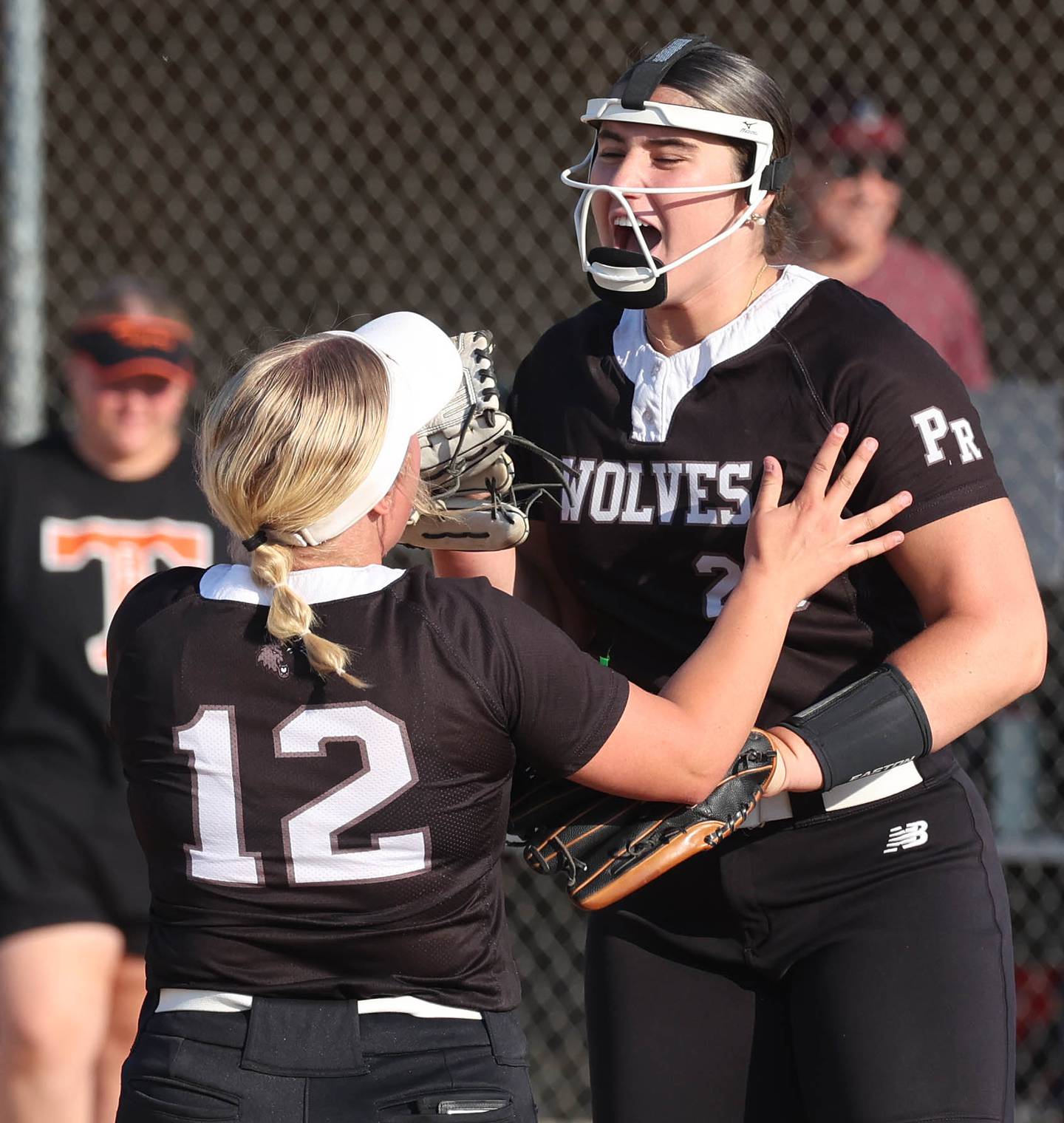 Prairie Ridge's Reese Mosolino (right) and teammate Bella Moore celebrate Friday, June 6, 2025, after their Class 3A sectional final win over Crystal Lake Central at Sycamore High School.
