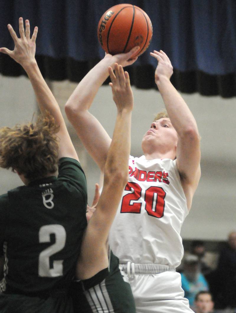 Earlville's Griffin Cook shoots past St. Bede's Kaden Nauman in the Marquette Holiday Tournament on Tuesday, Dec. 26, 2023.