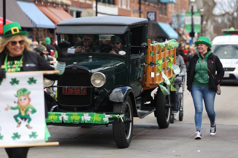 Associated Orthodontist drives a vintage truck in the Plainfield Hometown Irish Parade on Sunday, March 17, 2024 in Plainfield.