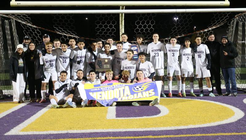 Members of the Mendota boys soccer team pose with the Class 1A Supersectional plaque after defeating Quincy Notre Dame during the Class 1A Supersectional game on Monday, Nov. 3, 2025 at Mendota High School.