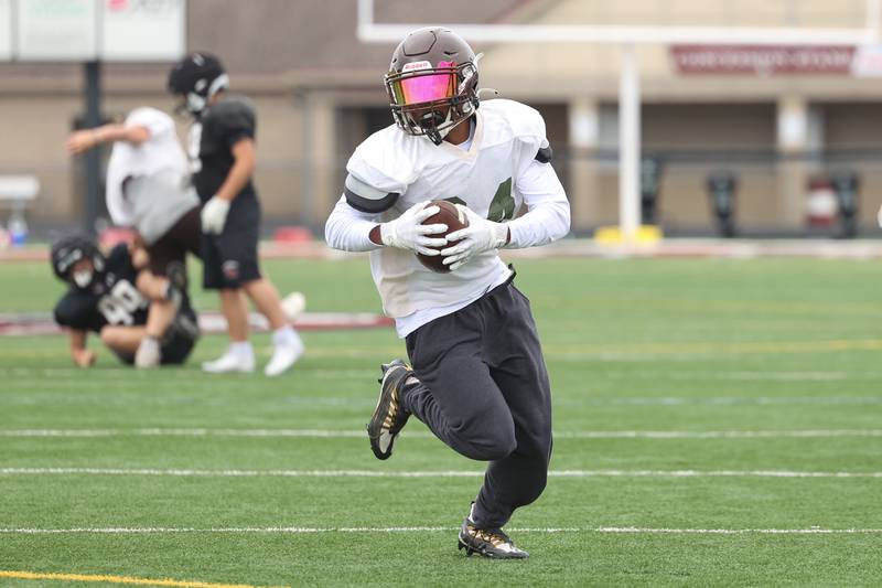 Joliet Catholic’s Preston Coleman takes a catch upfield during a scrimmage against Plainfield North on Thursday, July 13th, 2023 at Plainfield North
