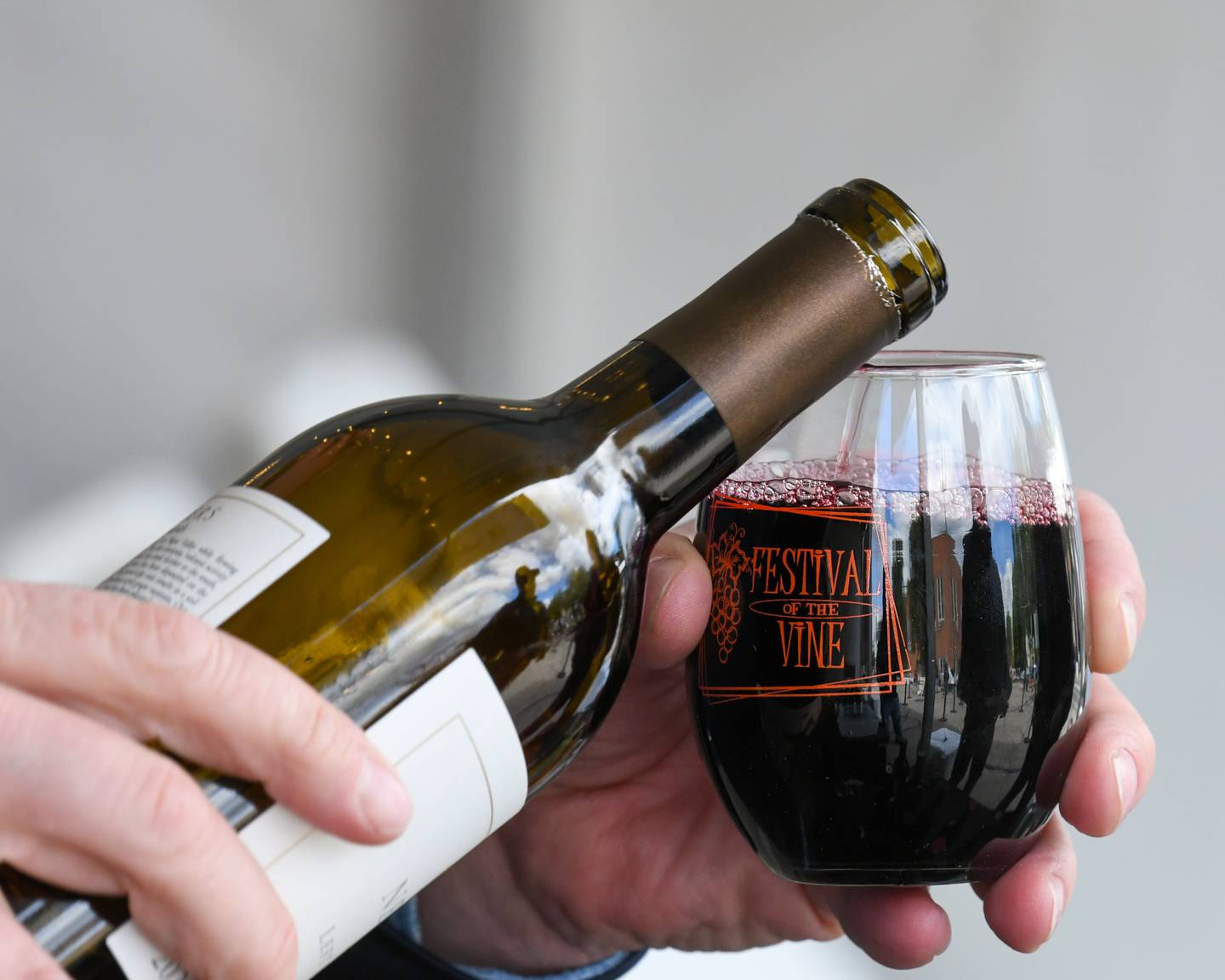 A glass of wine is poured on Friday Sept. 5, 2025, during the Festival of the Vine held in downtown Geneva.