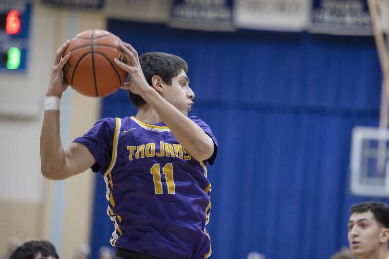 Mendota’s Izaiah Nanez pulls down a rebound against Newman Tuesday, Jan. 31, 2023.