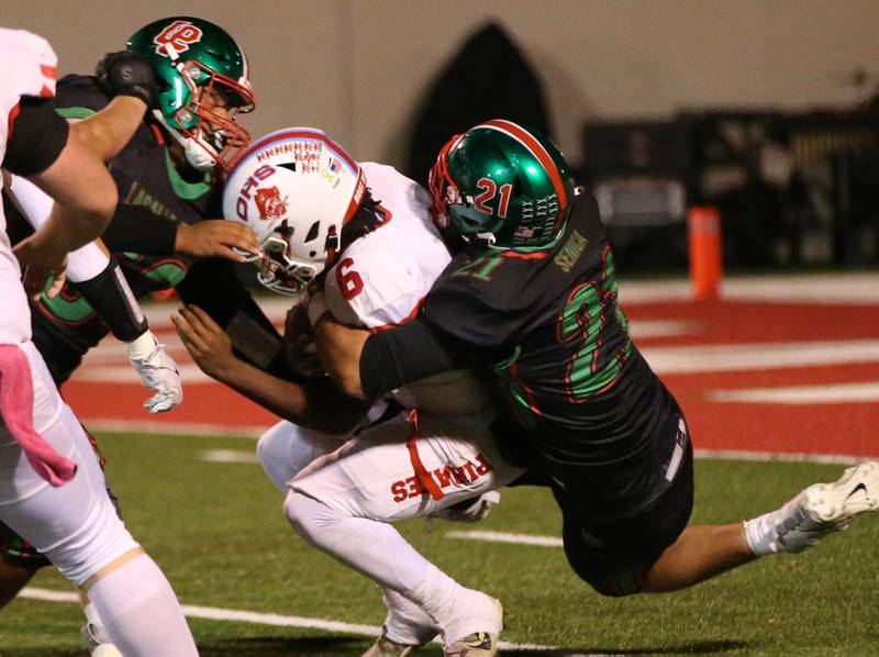 Ottawa quarterback Colby Mortenson is sacked by L-P's Josh Senica on Friday, Oct. 6, 2023 at Howard Fellows Stadium.