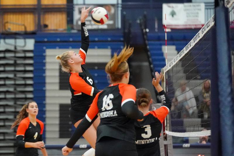 Minooka's Kendall Kozak (6) goes up for a kill attempt against Oswego East during a Southwest Prairie Conference match in Oswego on Thursday, Sept. 18, 2025.