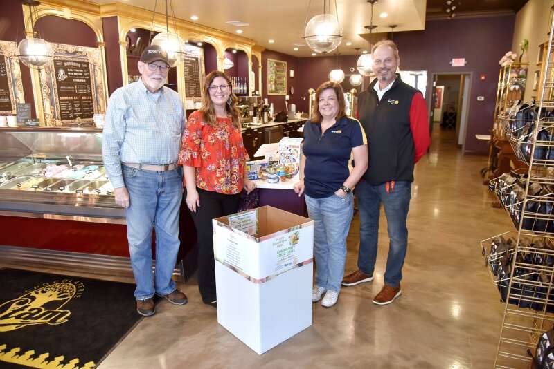 Chocolaterie Stam in Glen Ellyn has a large donation bin to collect food for the College of DuPage Fuel Pantry. From left are Paul Keenon, Rotary Assistant Governor; Rotary board member Erika Krehbiel, chief communications officer for Glen Ellyn School District 41; Liz Mager, owner of Chocolaterie Stam and the club's past president; and Rob Wilkinson, B.R. Ryall YMCA CEO and president of the Glen Ellyn Rotary Club.