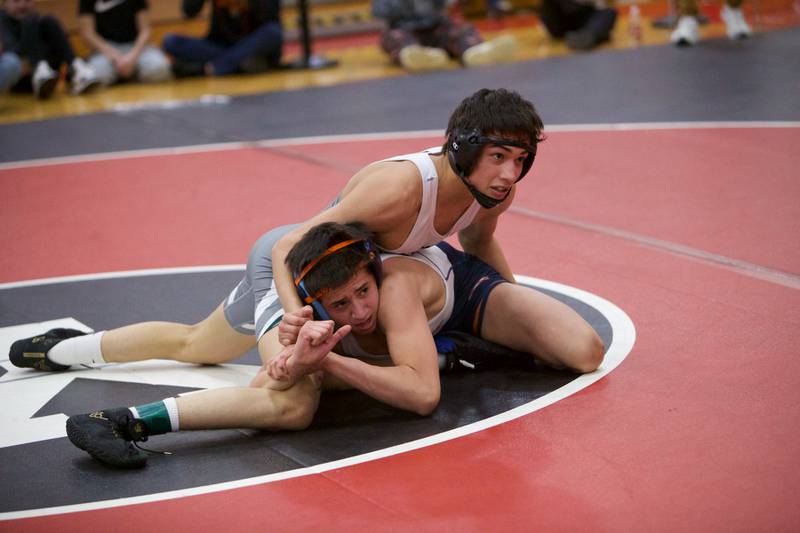 Planfield East's Aiden Villar competes with Oswego's Aiden Ortiz in the 120 lb. class Final at the Class 3A Regional on Saturday, Feb.3,2024 in Yorkville.