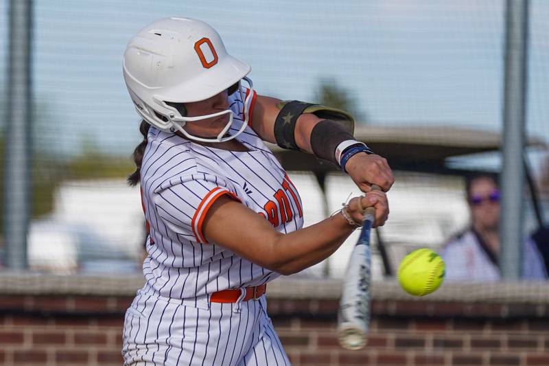 Oswego’s Kiyah Chavez (10) connects for  a single against Minooka during a Southwest Prairie Conference softball game at Oswego High School on Wednesday, April 23, 2025.