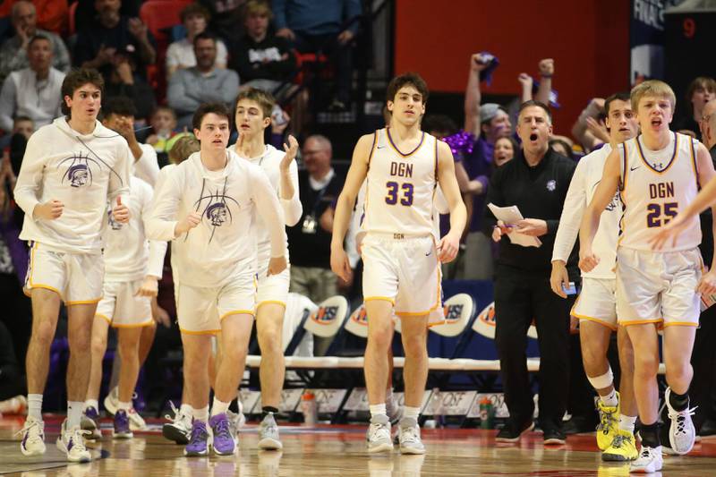 Members of the Downers Grove North boys basketball team react when taking a timeout against Moline during the Class 4A state semifinal game on Friday, March 10, 2023 in Champaign.